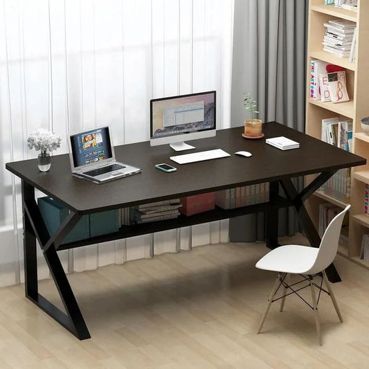 Modern office desk with laptop, monitor, and chair in a home office setting.